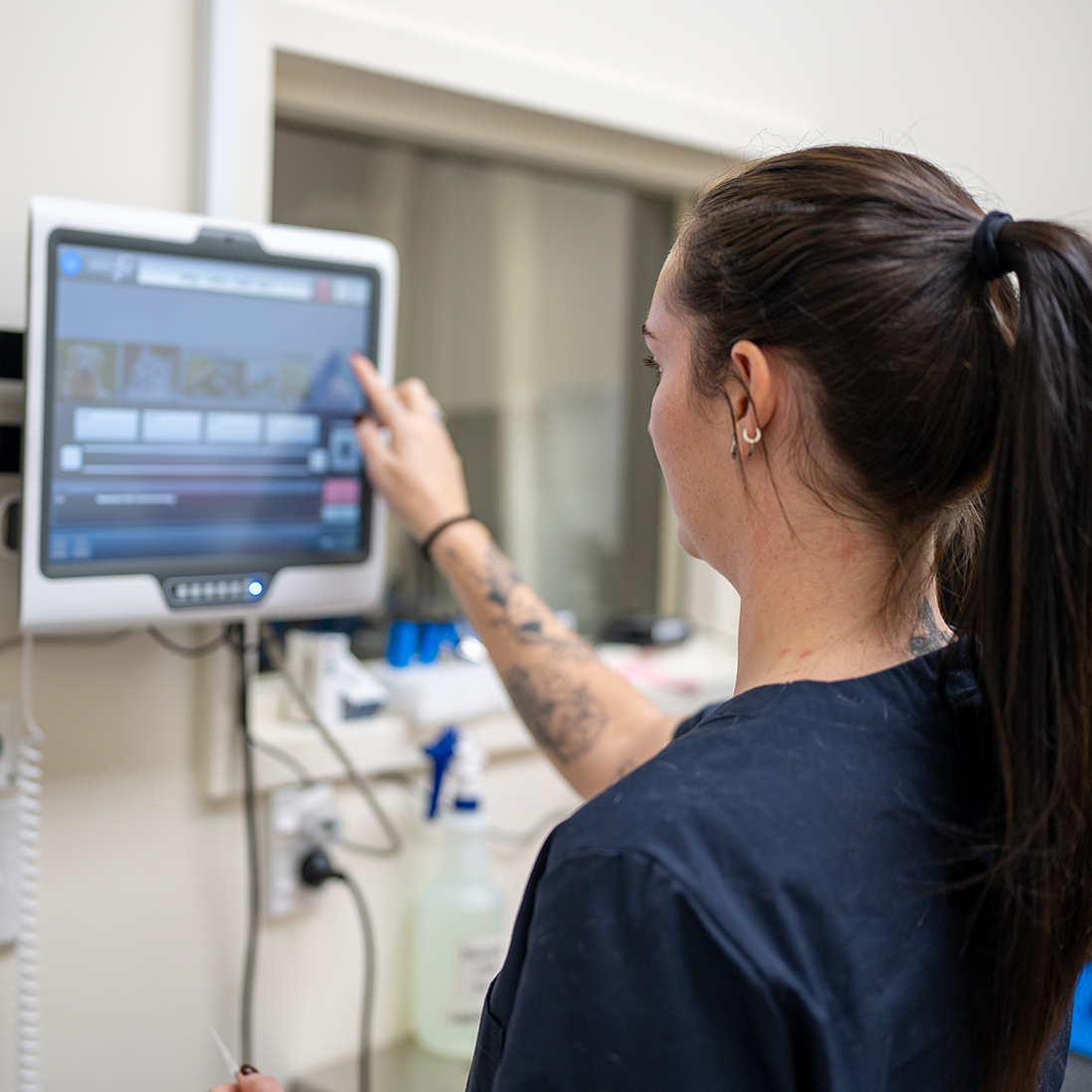 Female Doctor using Modern Medical Technology